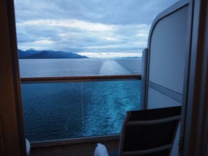 Watching the sun set in Alaska from an aft balcony